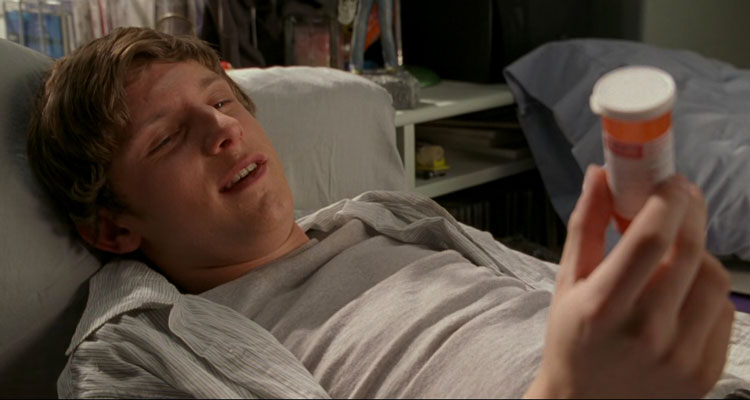 The Chumscrubber 2005 Movie Scene Jamie Bell as Dean holding a bottle of pills