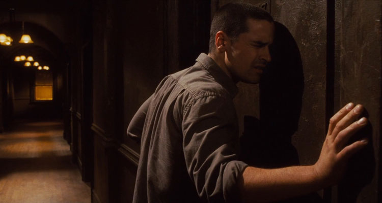 The Echo 2008 Movie Scene Jesse Bradford as Bobby Reynolds listening to strange sounds coming from the wall