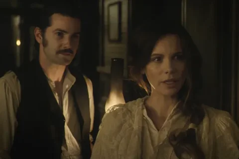 Stonehearst Asylum 2014 Movie Scene Kate Beckinsale as Eliza Graves and Jim Sturgess as Edward Newgate wandering the halls of the asylum