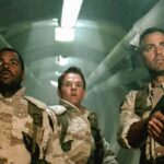 Three Kings 1999 Movie Scene George Clooney as Archie, Mark Wahlberg as Troy and Ice Cube as Chief in an underground bunker looking at the gold