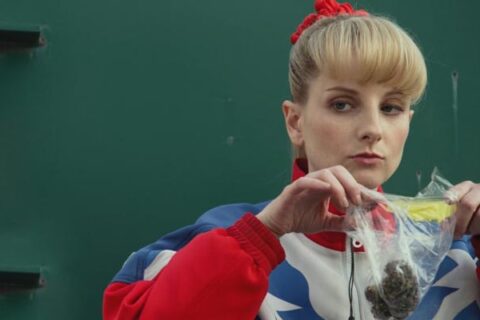 The Bronze 2015 Movie Scene Melissa Rauch as Hope Ann Greggory smelling the weed she just bought